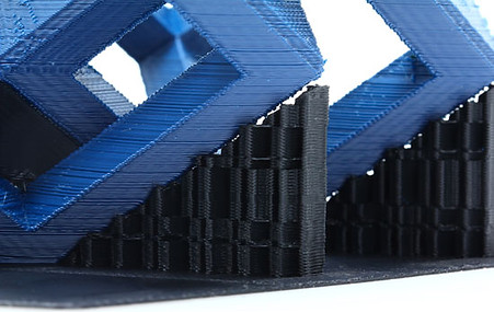 Blue 3D printed scuplture with supports